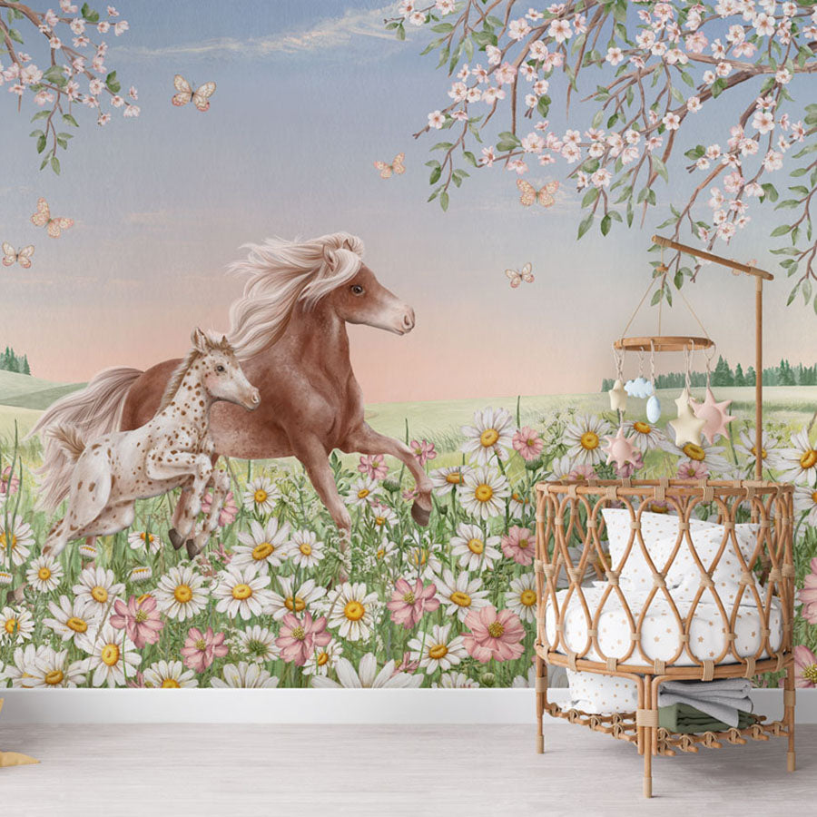 Happy Horses wallpaper mural in a nursery rattan cot