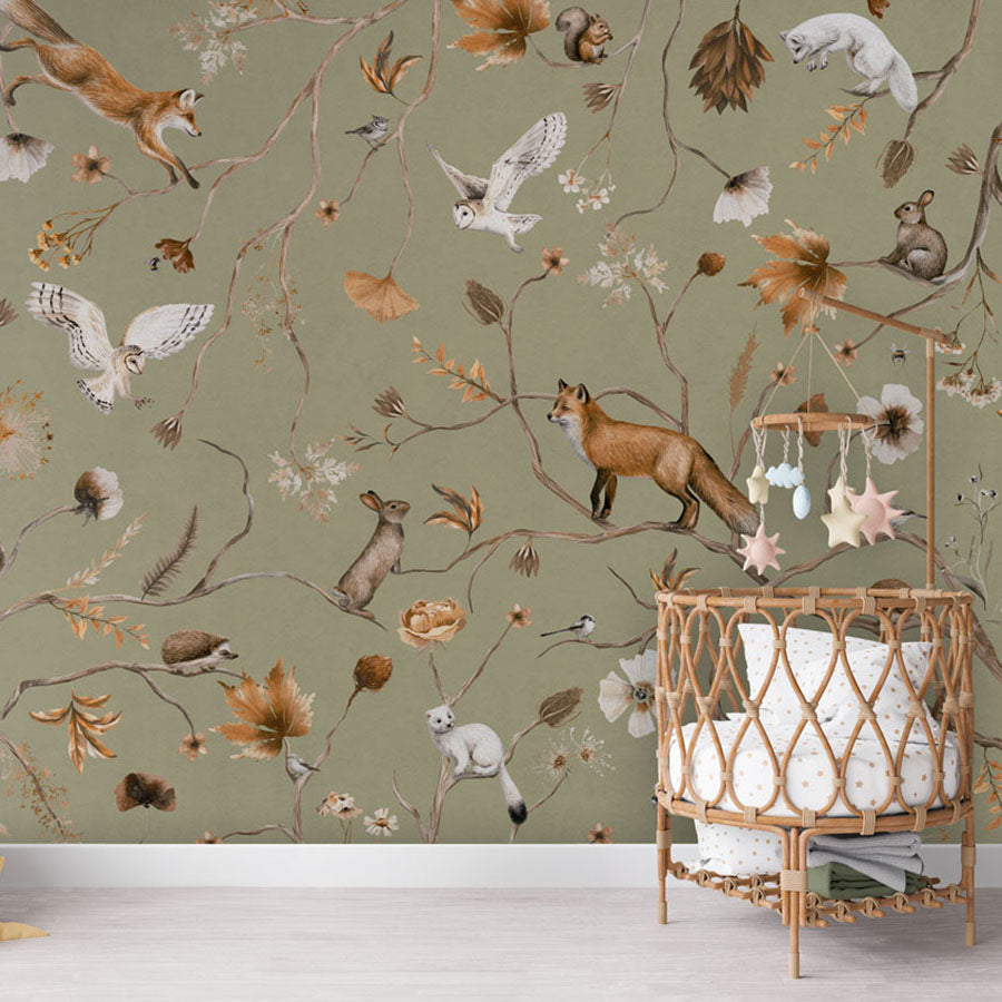 Playful Forest – Green wallpaper mural in a rattan crib