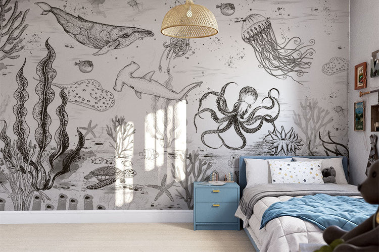 Boys Wallpaper in boy's bedroom showing an underwater creatures wallpaper with blue bedside table and bed