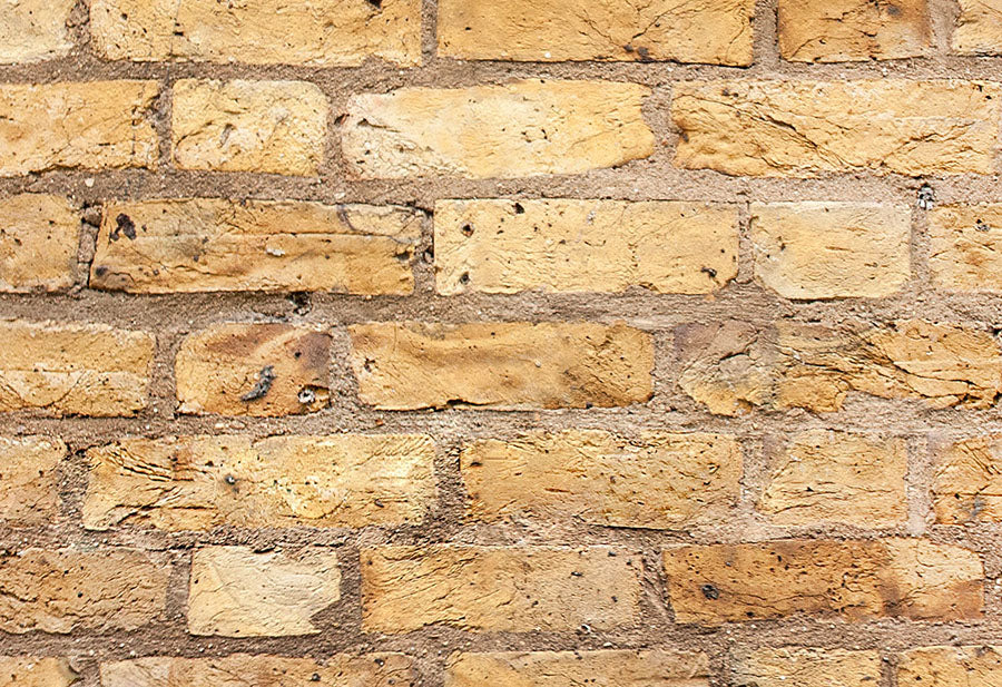 Close-up view of yellow brick effect wallpaper design