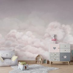 Calming Clouds – Pink wallpaper mural shown in a children's bedroom armchair
