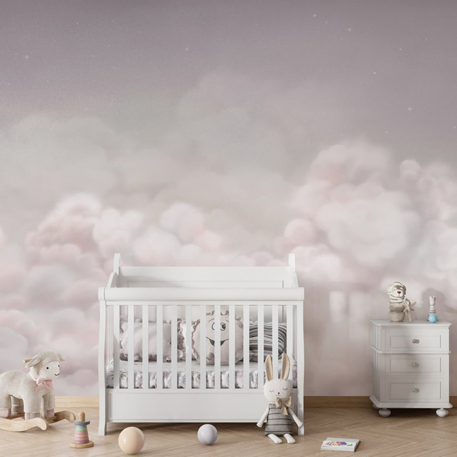 Calming Clouds – Pink wallpaper mural shown in a children's nursery crib
