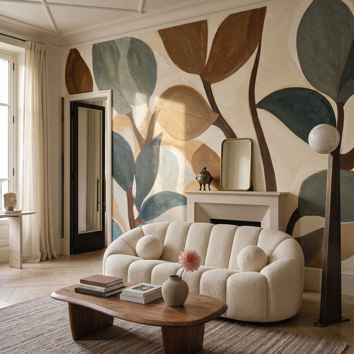 Emil's Garden wallpaper mural shown in living room with boucle sofa and fireplace