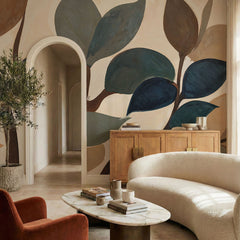 Emil's Garden wallpaper mural shown in living room with white sofa and sideboard
