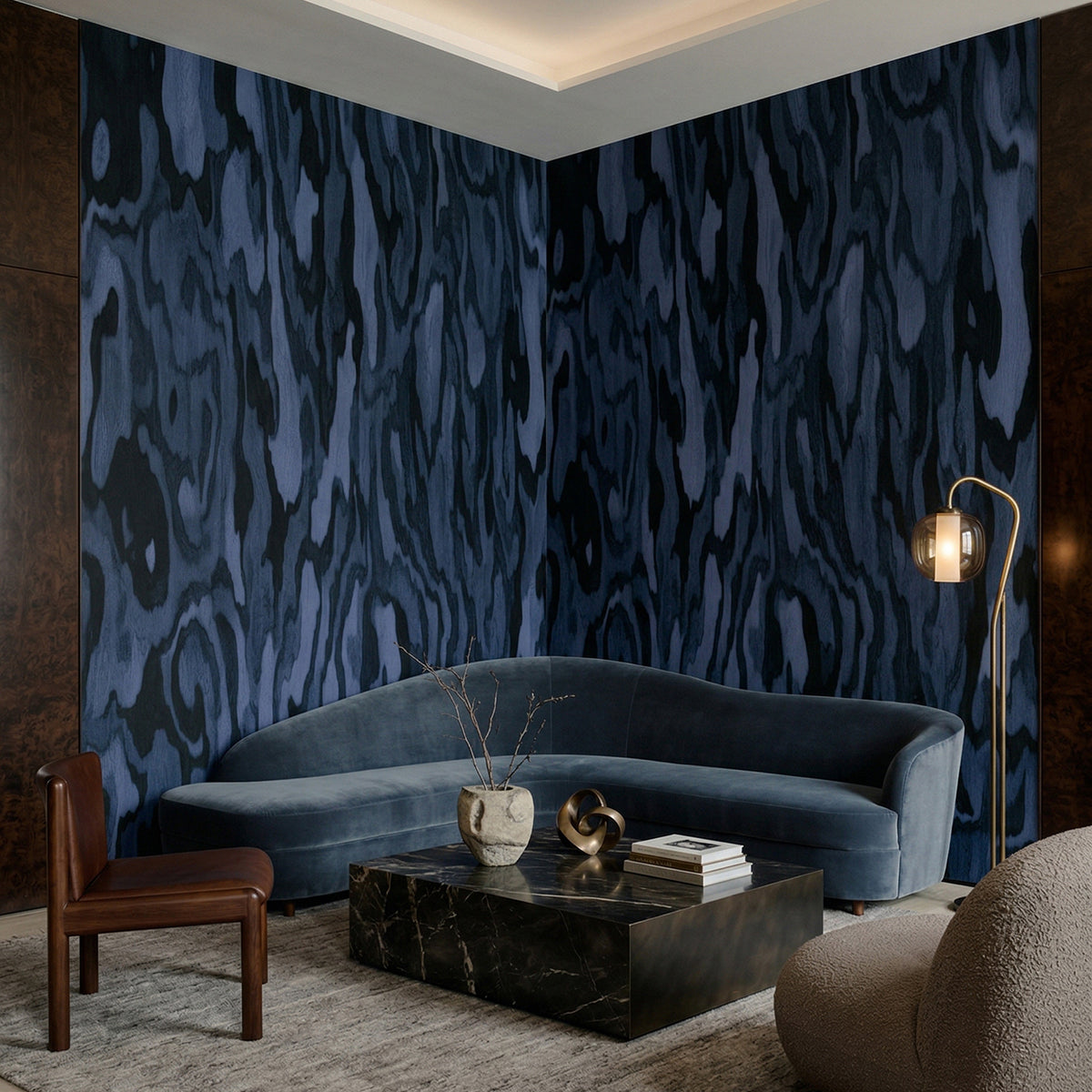 Ettore Burl wallpaper mural shown in living room with blue sectional and black table