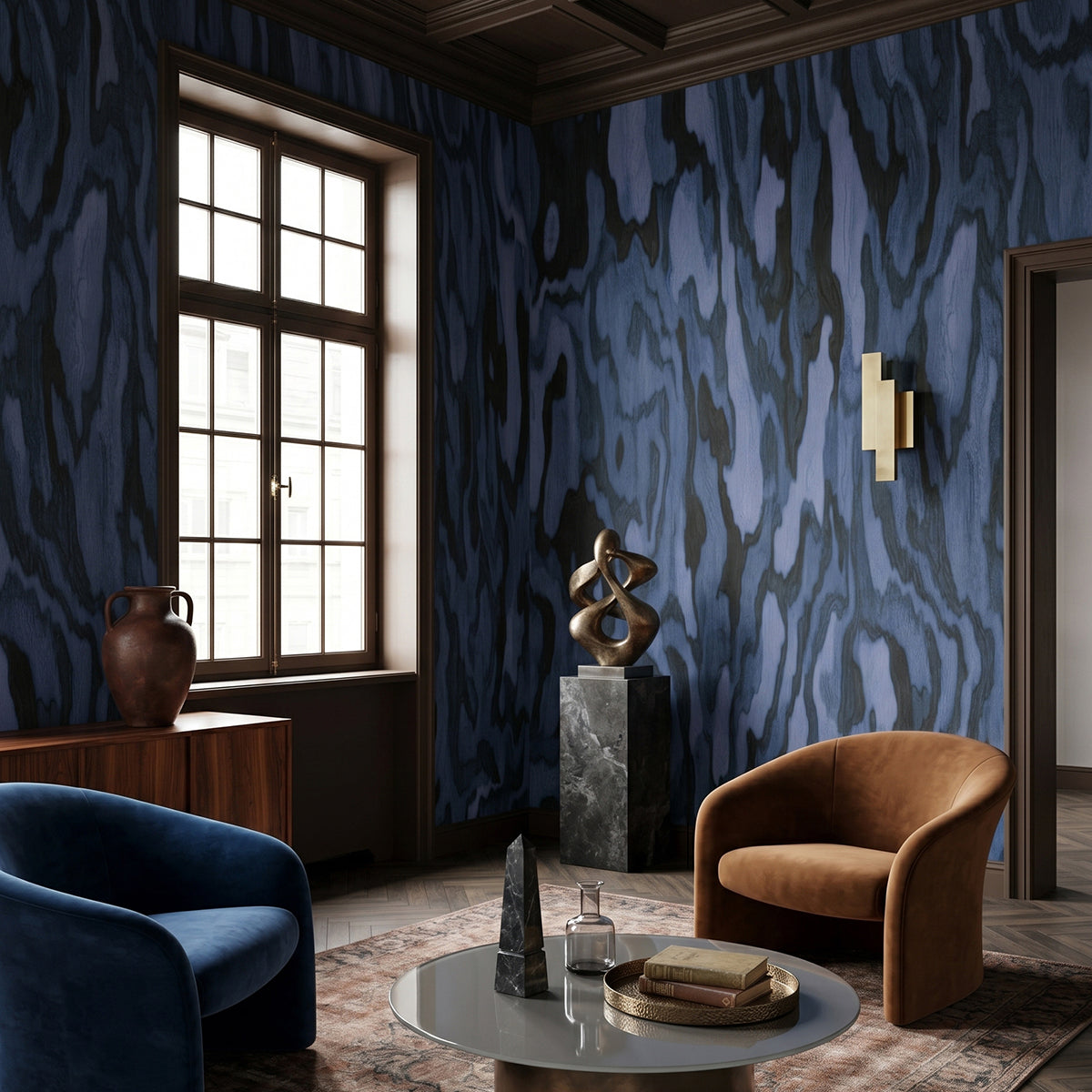 Ettore Burl wallpaper mural shown in living room with blue sofa and tan armchair