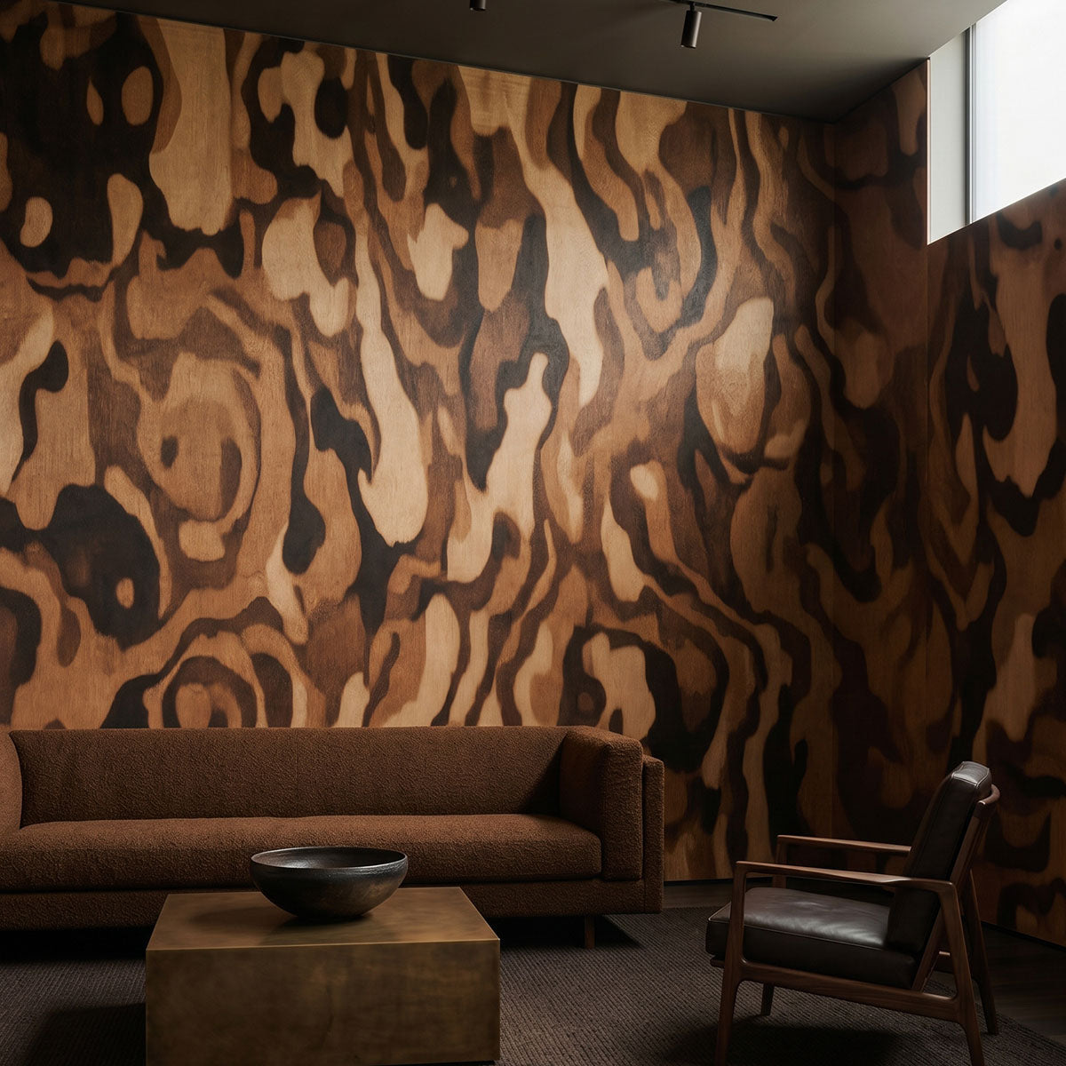 Ettore Grain wallpaper mural shown in living room with brown sofa and black chair