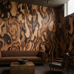 Ettore Grain wallpaper mural shown in living room with brown sofa and black chair