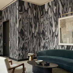 Ettore Root wallpaper mural shown in living room with teal sofa and white chair