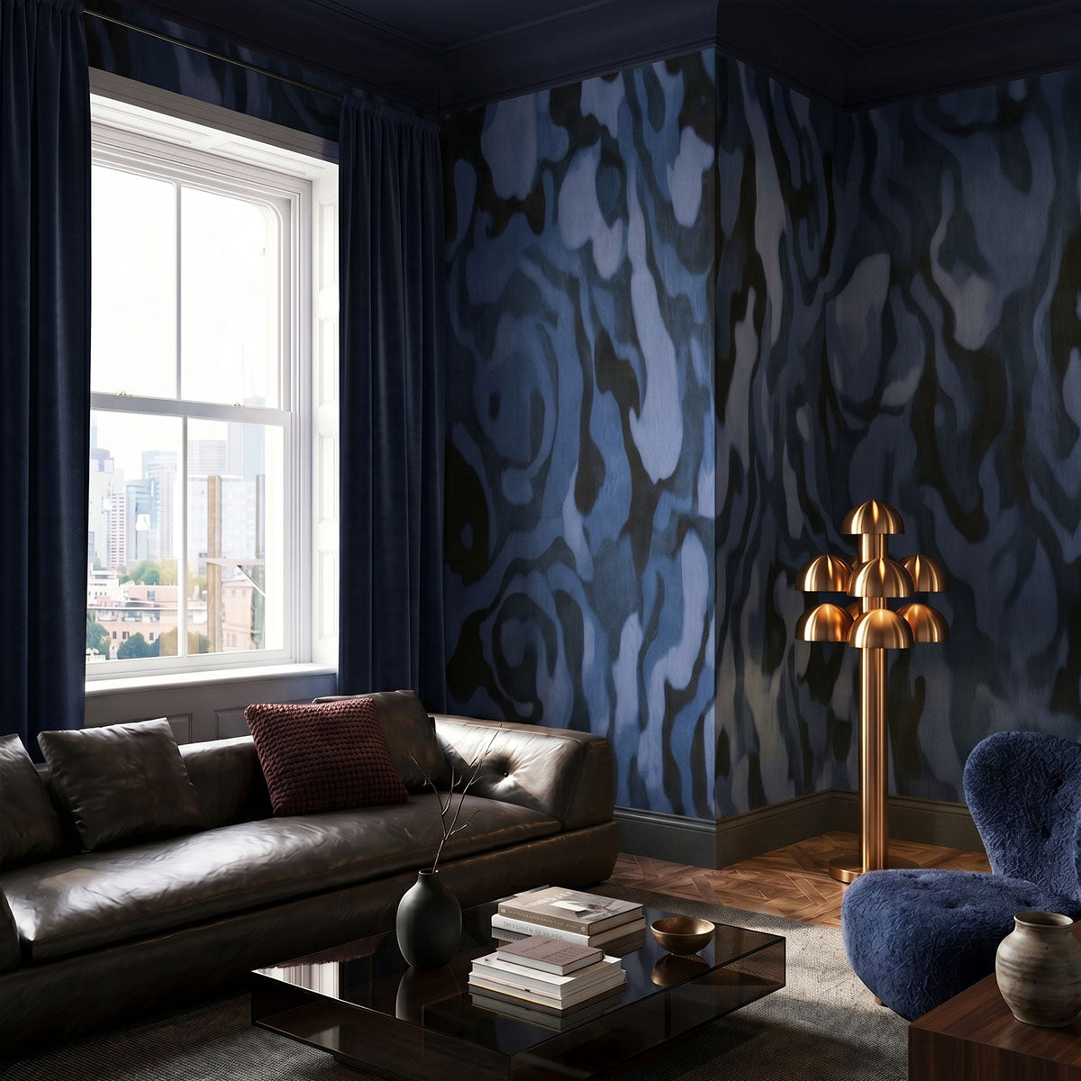 Ettore Veins wallpaper mural shown in living room with black sofa and blue chair