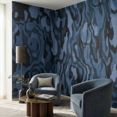 Ettore Veins wallpaper mural shown in living room with two grey armchairs