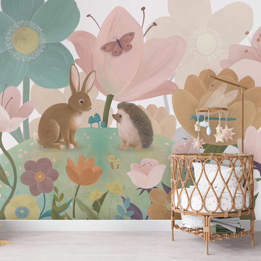 Flowery Hill wallpaper mural shown in a children's nursery crib