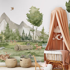 Forest Joy wallpaper mural shown in a children's nursery crib