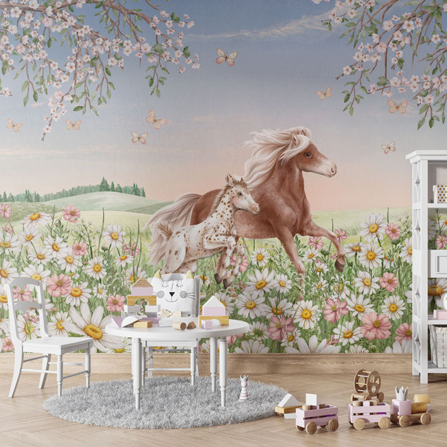 Happy Horses wallpaper mural in a children’s playroom table chairs