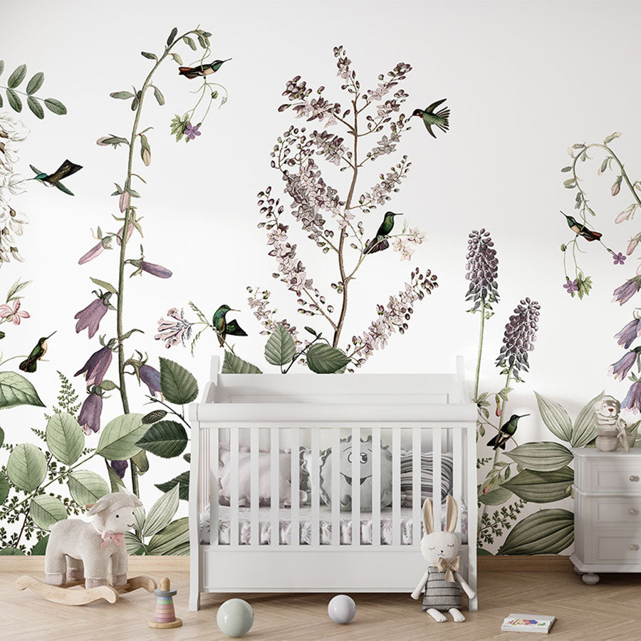 Hummingbird Hedge wallpaper mural in a nursery cot