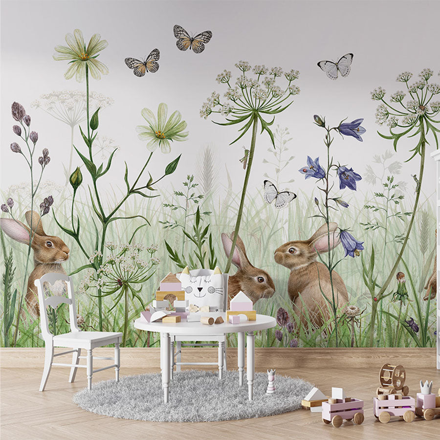 In the Undergrowth wallpaper mural in a children’s playroom table chairs