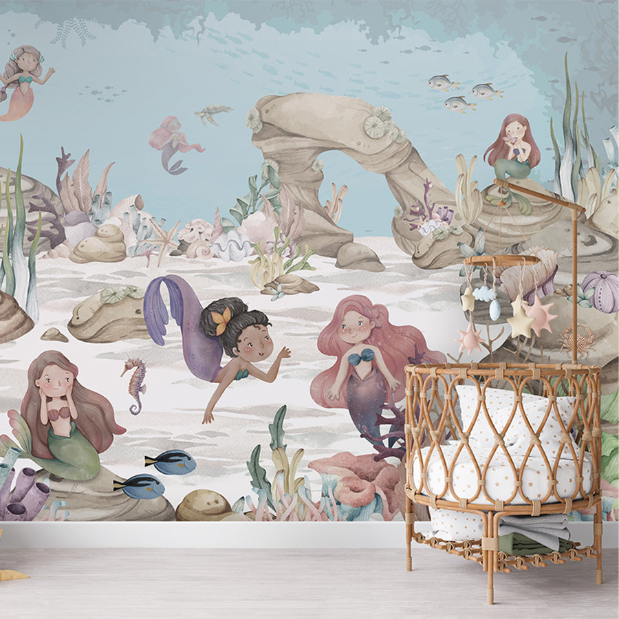 Mermaid Miracles wallpaper mural shown in a children's nursery crib