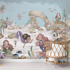 Mermaid Miracles wallpaper mural shown in a children's nursery crib