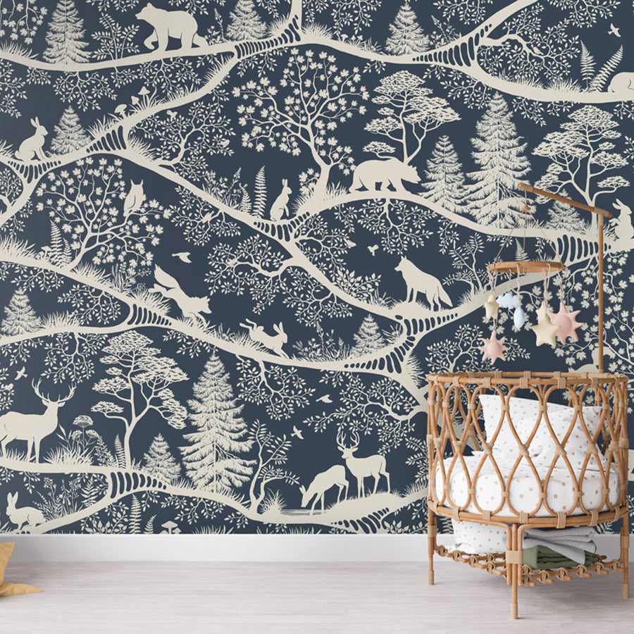 Nordic Nature – Blue White wallpaper mural shown in a children's nursery crib