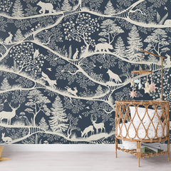 Nordic Nature – Blue White wallpaper mural shown in a children's nursery crib