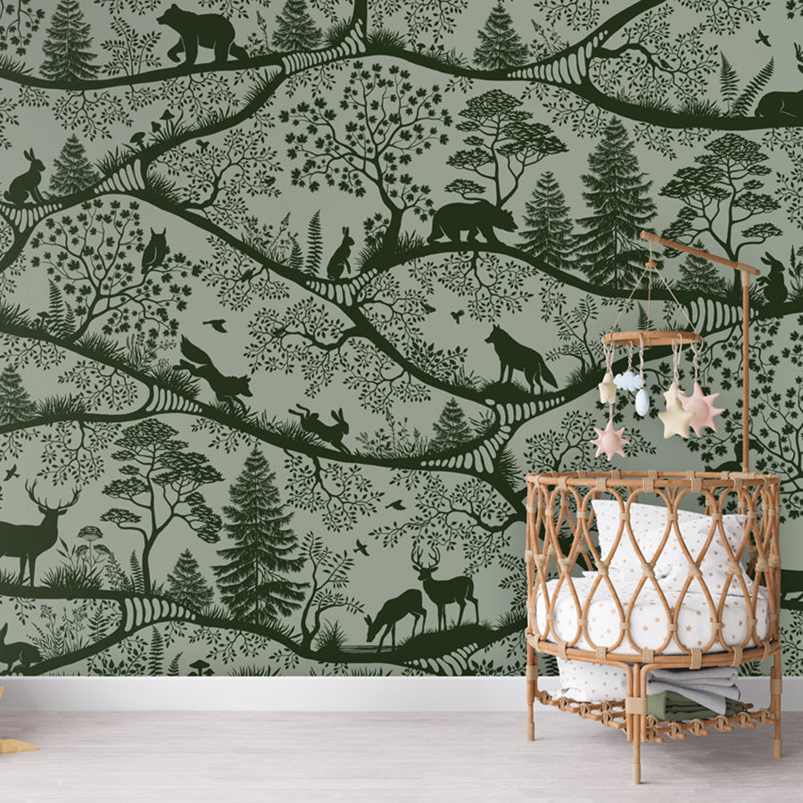 Nordic Nature – Green Green wallpaper mural shown in a children's nursery crib