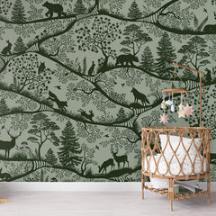 Nordic Nature – Green Green wallpaper mural shown in a children's nursery crib