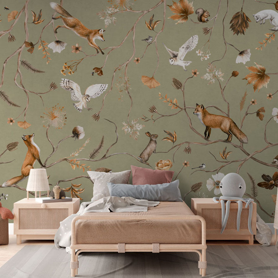 Playful Forest – Green wallpaper mural in a children’s rattan bed