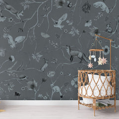 Playful Forest – Monochrome Blue wallpaper mural in a rattan crib