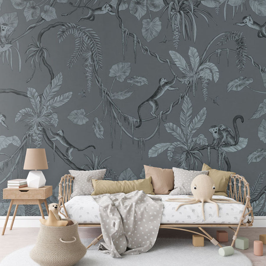 Playful Monkeys – Monochrome Blue wallpaper mural in a rattan daybed