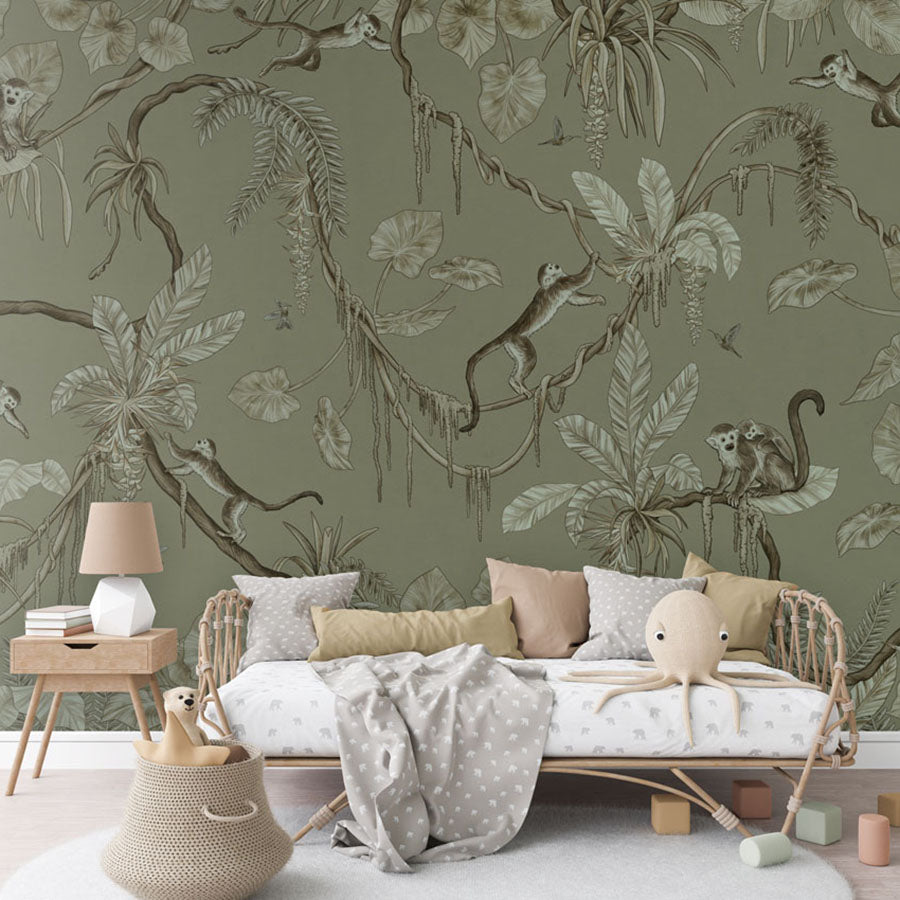 Playful Monkeys – Monochrome Green wallpaper mural in a rattan daybed