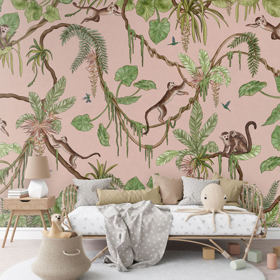 Playful Monkeys – Pink wallpaper mural in a rattan daybed