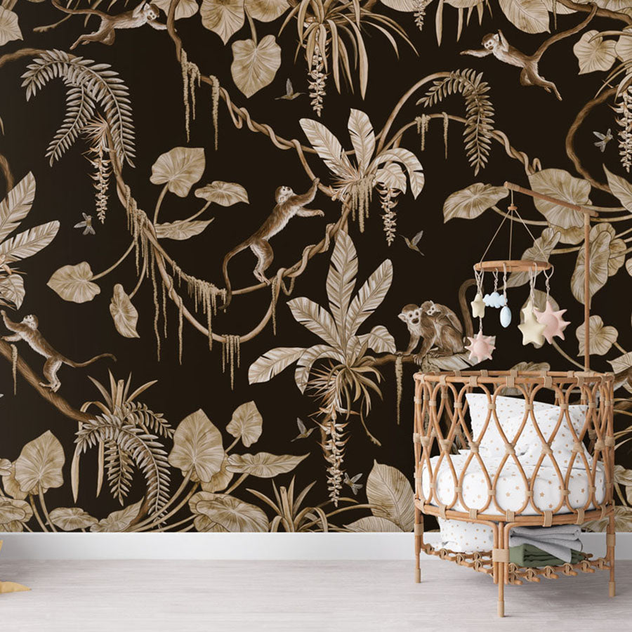 Playful Monkeys – Vintage Black wallpaper mural in a nursery rattan cot