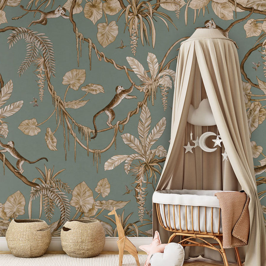 Playful Monkeys – Vintage Green wallpaper mural in a nursery rattan cot canopy