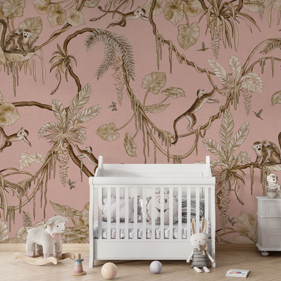 Playful Monkeys – Vintage Pink wallpaper mural in a nursery crib