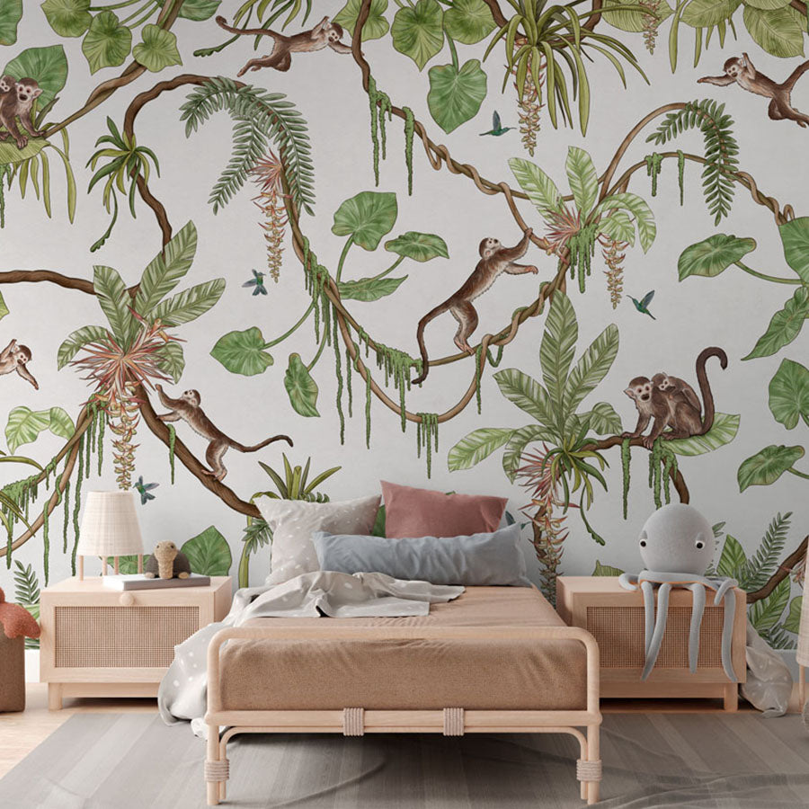 Playful Monkeys – White wallpaper mural in a rattan bed