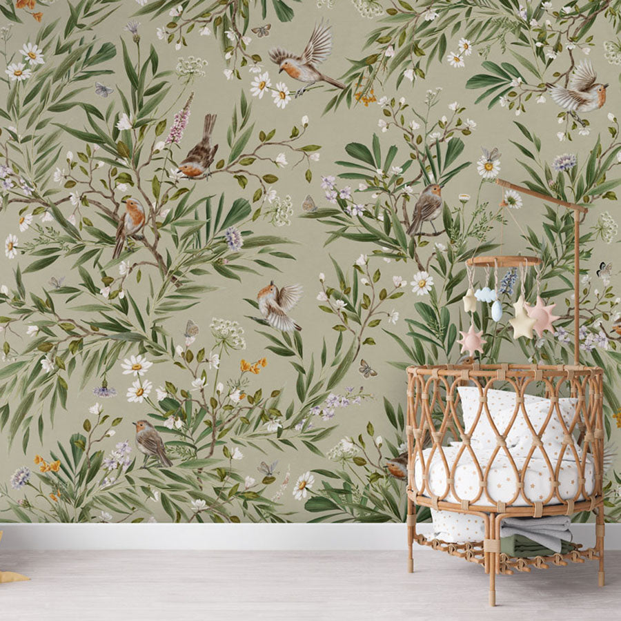 Playful Robins – Green wallpaper mural in a nursery rattan cot