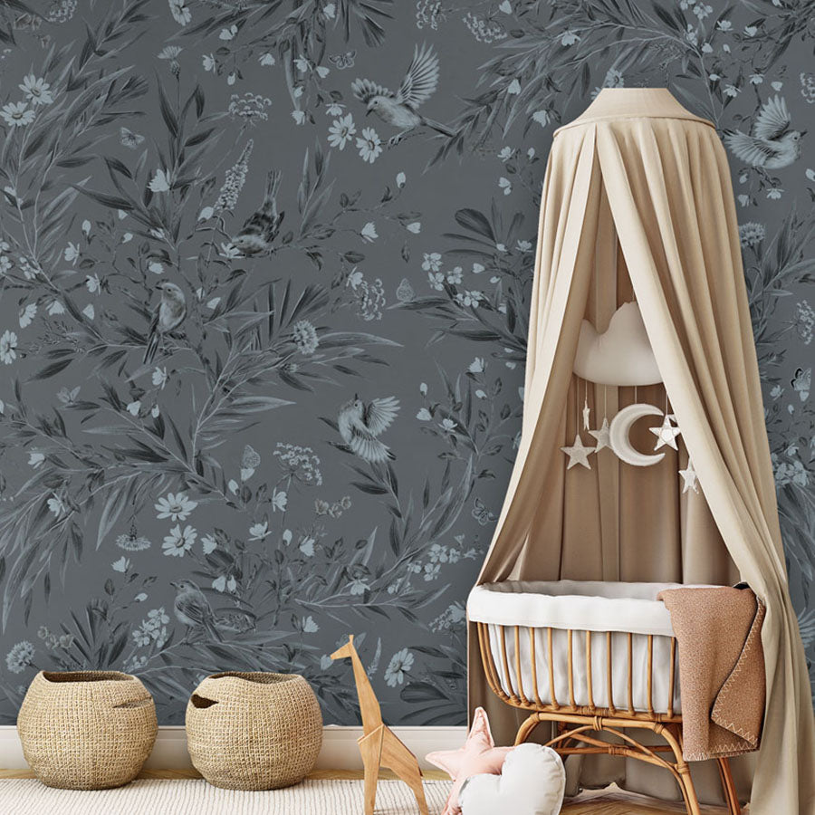 Playful Robins – Monochrome Blue wallpaper mural in a nursery rattan cot canopy