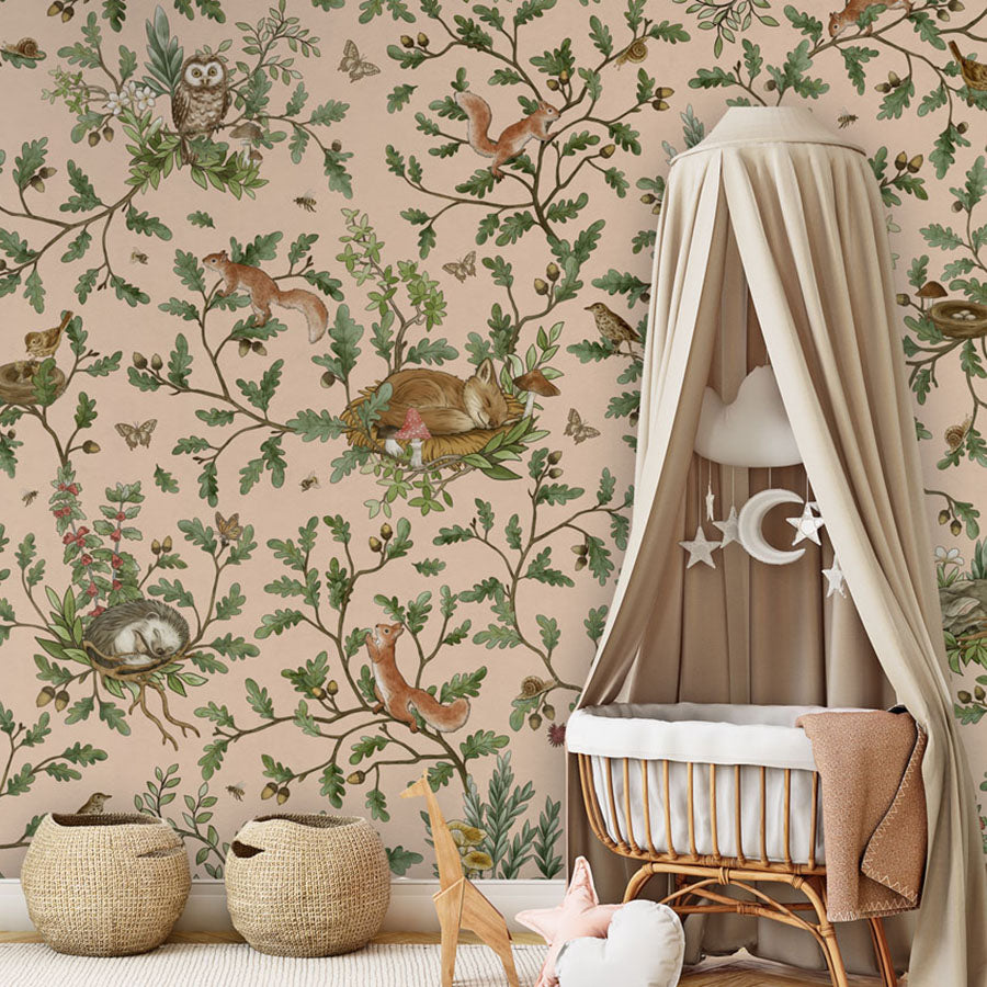 Playful Woods – Beige wallpaper mural in a nursery rattan cot canopy