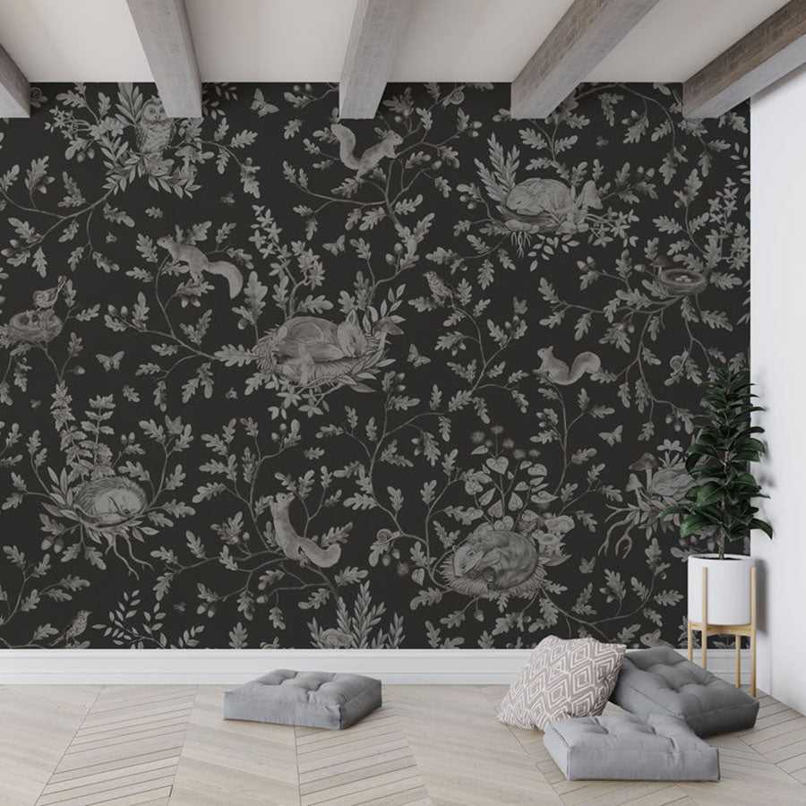 Playful Woods – Monochrome Black wallpaper mural in a hanging chair floor cushions
