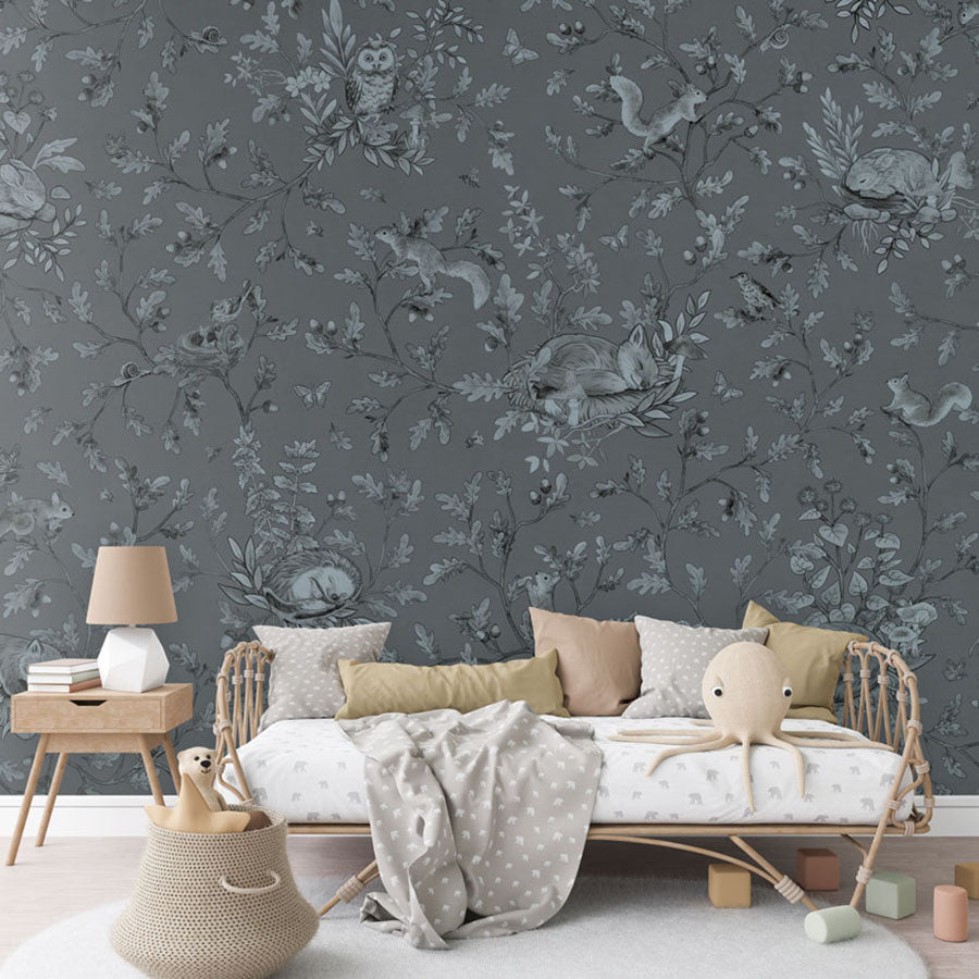 Playful Woods – Monochrome Blue wallpaper mural in a rattan daybed