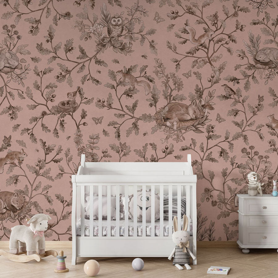 Playful Woods – Monochrome Pink wallpaper mural in a nursery crib