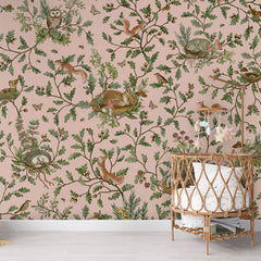 Playful Woods – Pink wallpaper mural in a nursery rattan cot
