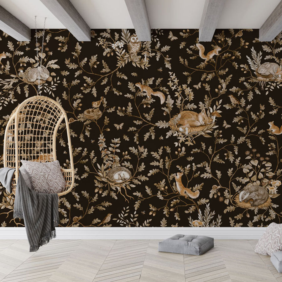 Playful Woods – Vintage Black wallpaper mural in a hanging chair floor cushions