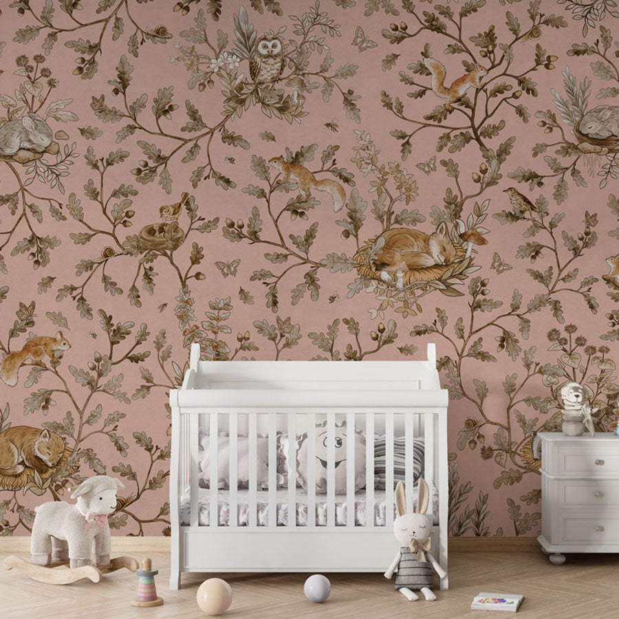 Playful Woods – Vintage Pink wallpaper mural in a nursery crib