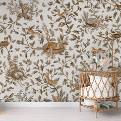 Playful Woods – Vintage White wallpaper mural in a nursery rattan cot