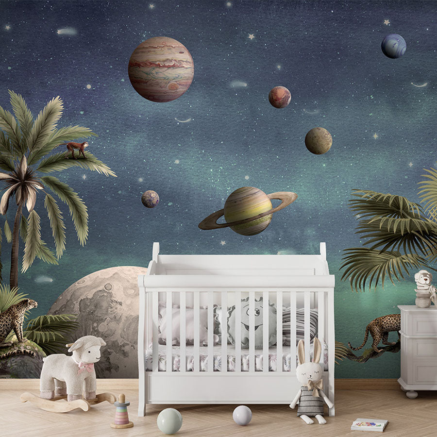 Pretty Planets wallpaper mural in a nursery cot