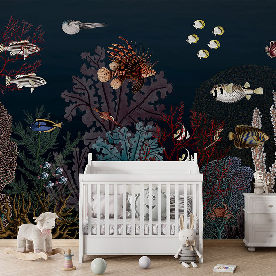 Roaring Reef – Blue wallpaper mural in a nursery cot
