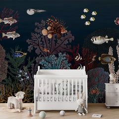 Roaring Reef – Blue wallpaper mural in a nursery cot