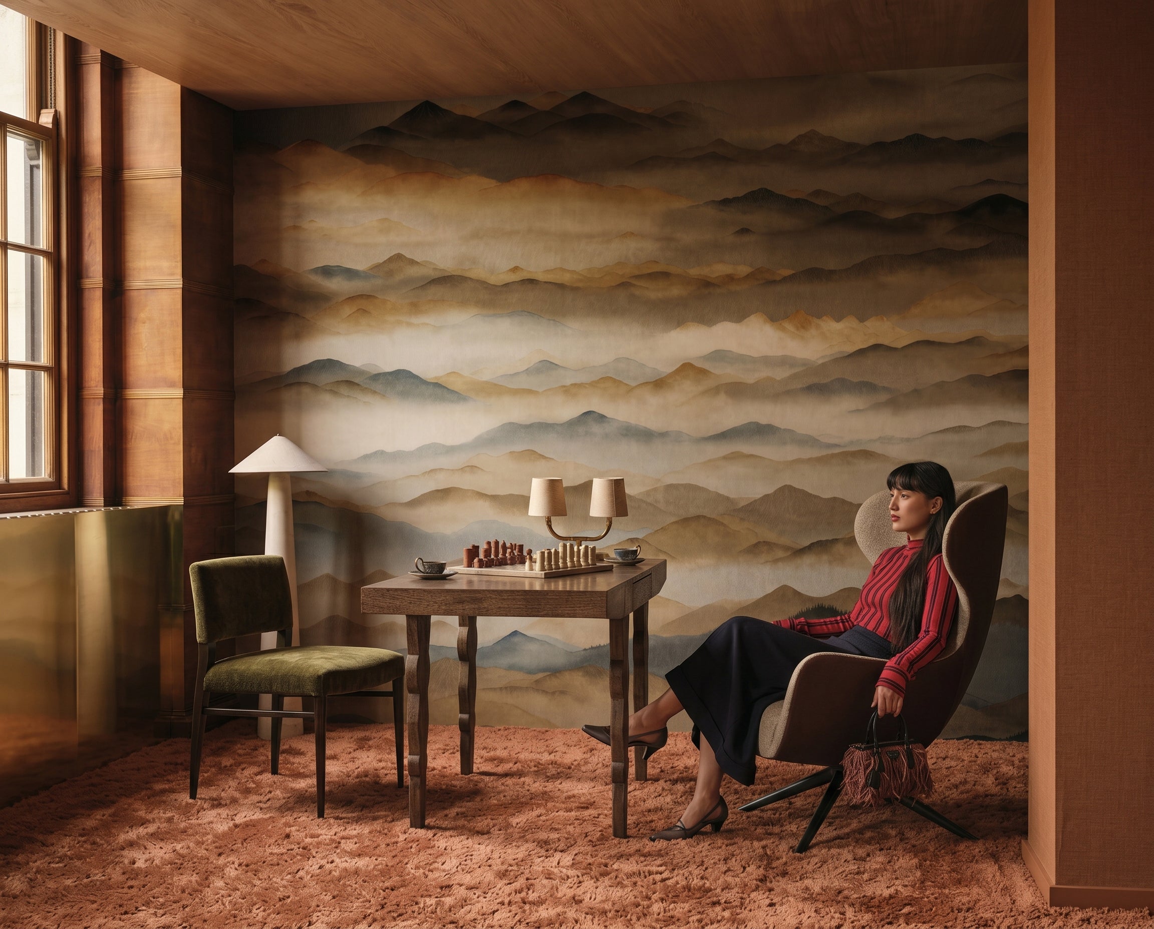 Roerich Twilight wallpaper mural shown in reading corner with table and red chair and portrait