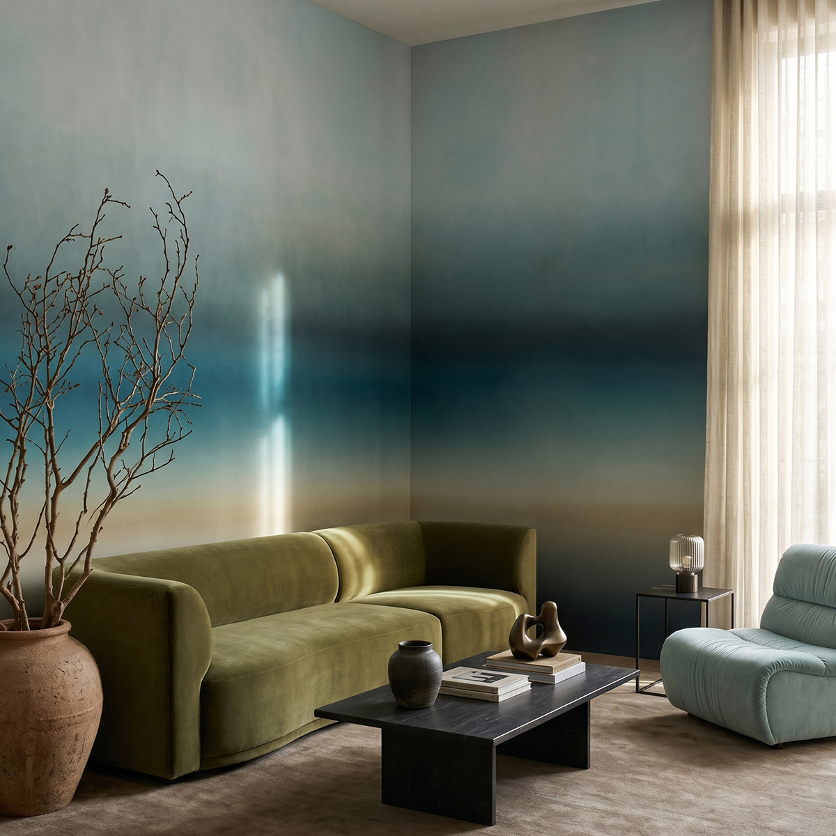 Rotko Blush wallpaper mural shown in living room with green sofa and blue chair